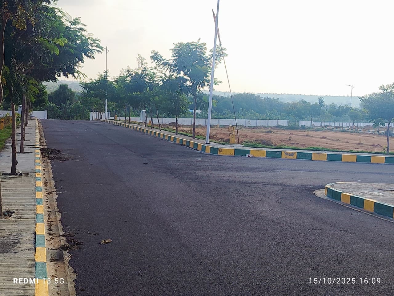 Site photo — bitumen road & kerb